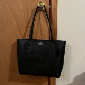Kate Spade black tote. New never used. Still in the box it was shipped in.